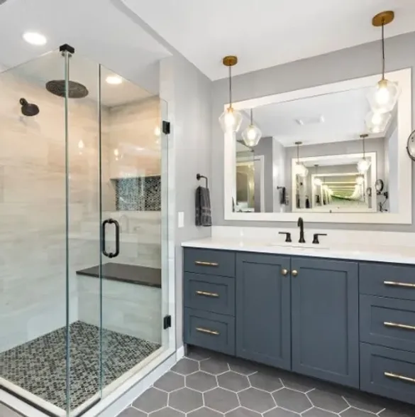 Bathroom with shower and sink, modern design with white tiles and chrome fixtures.